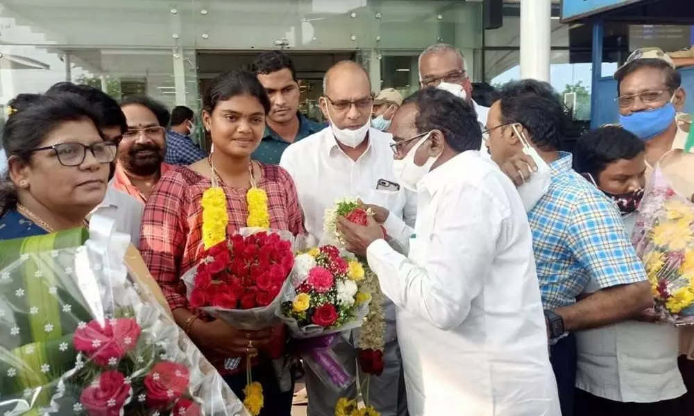 SAAP officials and others welcome archer Surekha at Gannavaram Airport on Tuesday night