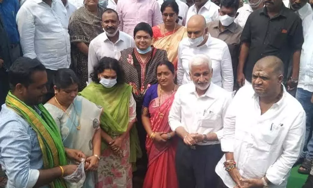 Rajya Sabha MP V Vijayasai Reddy and Tourism Minister M Srinivasa Rao laying foundation stone for theme park at MSR Nagar in Madhurawada in Visakhapatnam on Wednesday