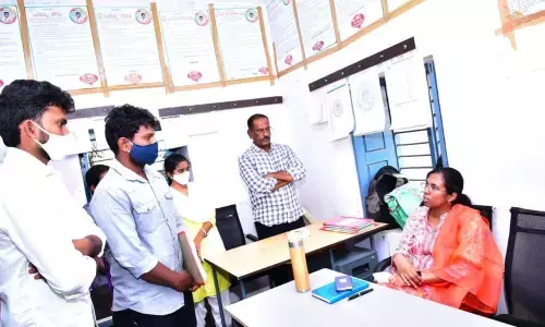 District Collector Nagalakshmi Selvarajan taking secretariat staff to task in a village in Anantapur.
