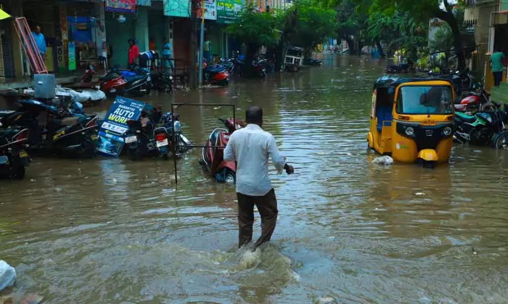 Floodwater enters houses at Korla Gunta Maruthi Nagar in Tirupati on Saturday