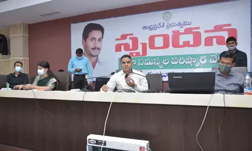 District Collector Vivek Yadav addressing a meeting in Guntur on Monday
