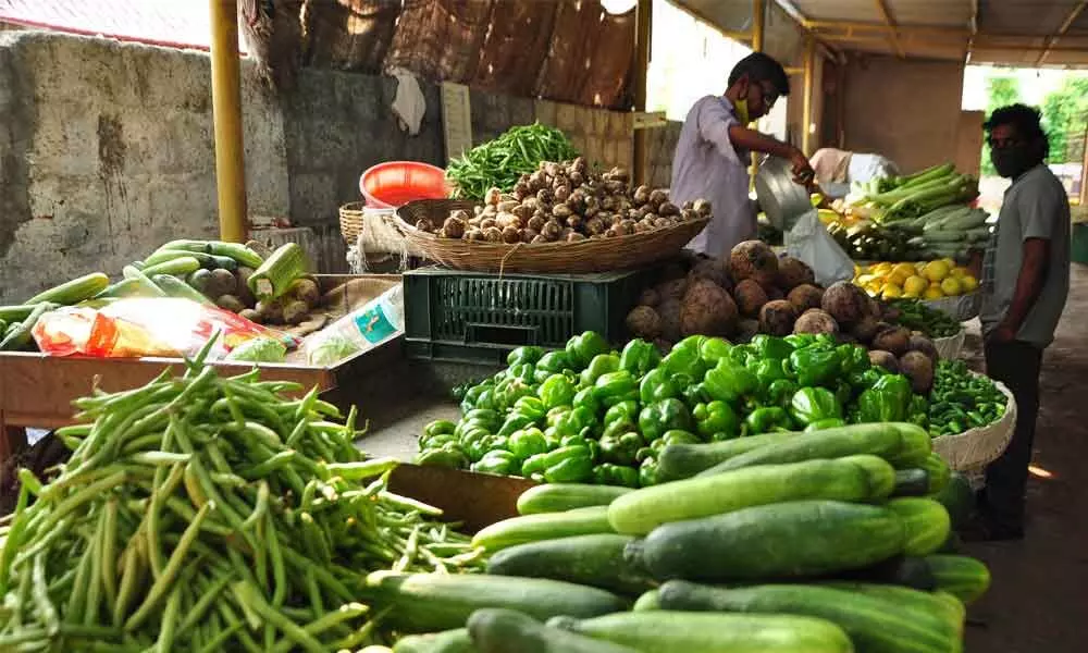 Vendors selling vegetables at a Rytu Bazaar in Guntur on Tuesday