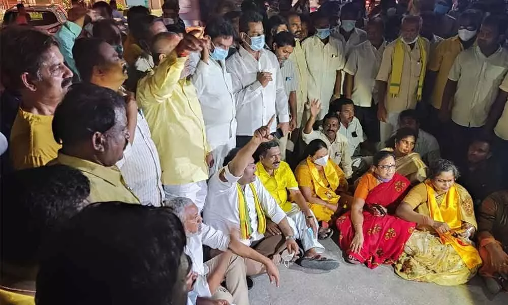 TDP leaders G Narasimha Yadav, P Nani, M Sugunamma and others staging a dharna at the Urban SP office in Tirupati on Tuesday night