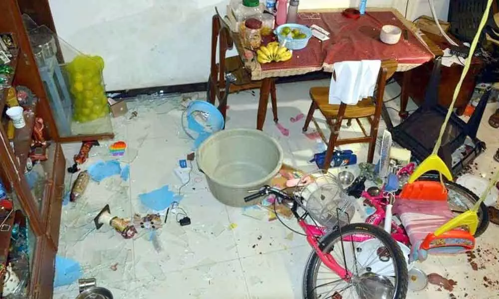 Damaged furniture and vehicles in the house of TDP leader Pattabhi Ram in Vijayawada on Tuesday