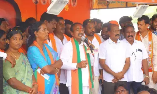 BJP candidate Eatala Rajender addressing an election campaign in Shalapally village in Huzurabad mandal on Tuesday