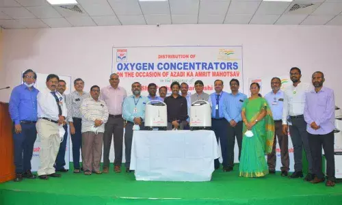 Director (HR) HPCL Pushp Kumar Joshi handing over oxygen concentrators to various hospital staff in Visakhapatnam on Tuesday