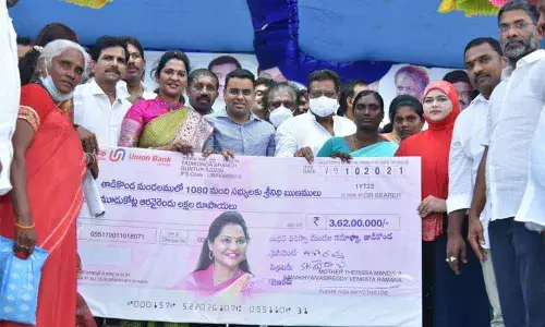 Minister Cherakuvada Sri Ranganadha Raju, MLA Dr Undavalli Sridevi distributing financial assistance under Aasara scheme in Guntur on Tuesday