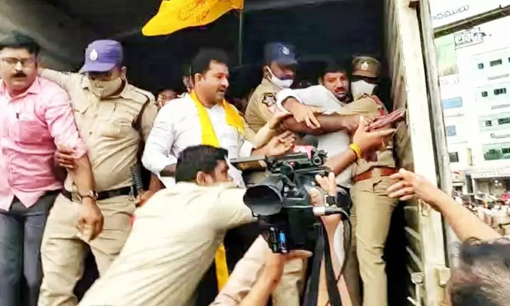 Police taking TDP activists into custody in a vehicle as they tried to take part in the statewide bandh on Wednesday in Visakhapatnam