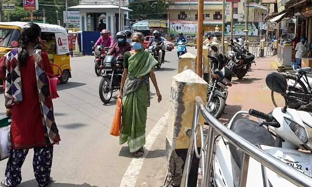 Shopkeepers encroaching the pedestrian path at Main Guard Gate in Tiruchy on Thursday.