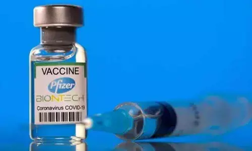 Pfizer says its booster restores full protection against Covid