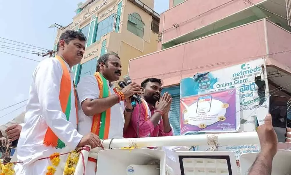 Union Minister of State for Fisheries, Animal Husbandry and Dairying L Murugan campaigning in Badvel Assembly constituency on Saturday. BJP MP C M Ramesh and party candidate for Badvel bypoll P Suresh (right) are also seen.