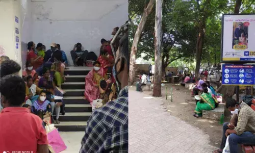 Patients sitting on the stairs waiting for their call to meet the doctor at NIMS, Hyderabad