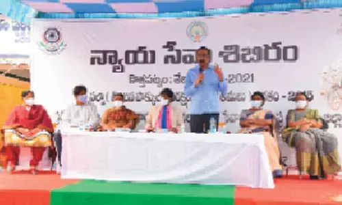 First additional district judge R Sivakumar speaking at the Legal Service Camp on NALSA in  Kothapatnam on Saturday
