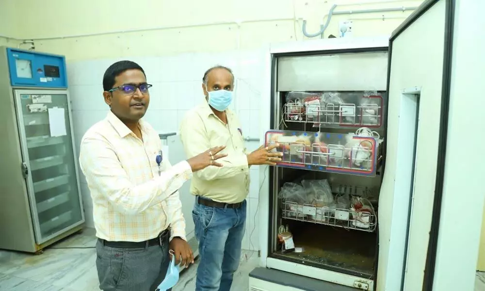 Ruia hospital blood bank in-charge medical officer Dr B H Purna Chandra Sekhar explaining the blood storage details in Tirupati