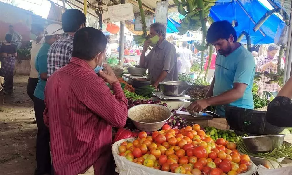 Customers at a Rythu Bazar in Kakinada on Sunday