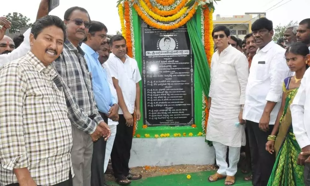 Buggana Rajendranath Reddy unveiling a plaque to mark the inauguration of road widening works at Gorumankonda village in Kurnool on Sunday