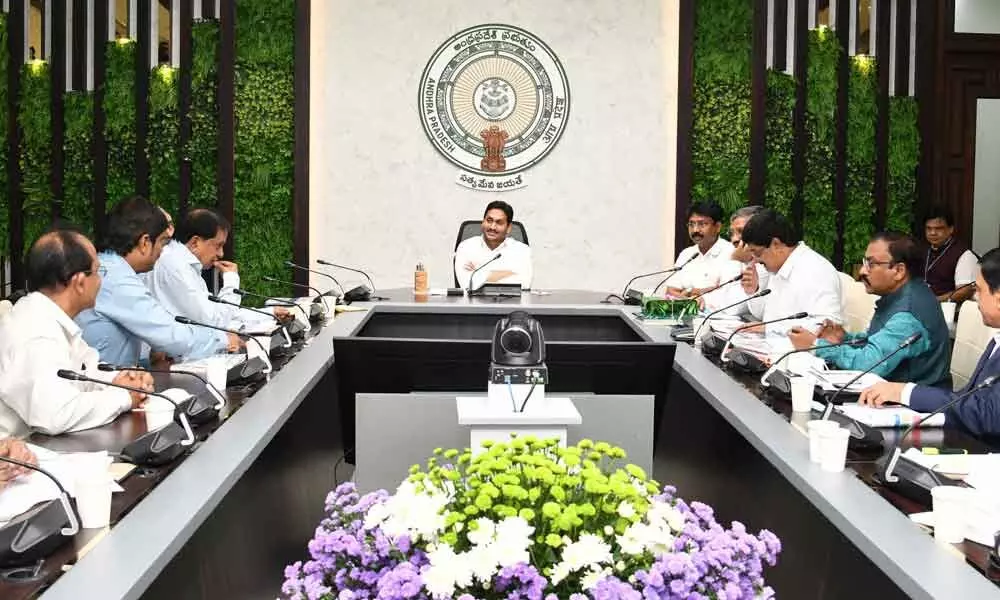 Chief Minister Y S Jagan Mohan Reddy reviews higher education at his camp office in Tadepalli on Monday