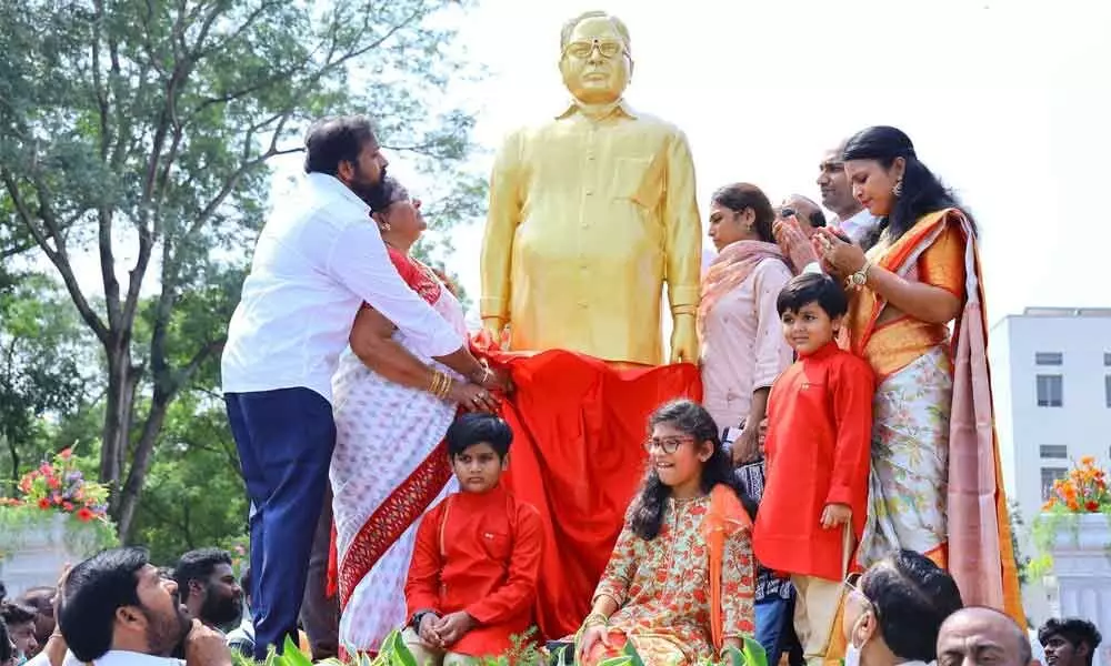 The members of Kandula family garlanding the statue of K Sivananda Reddy  in Tirupati on Monday