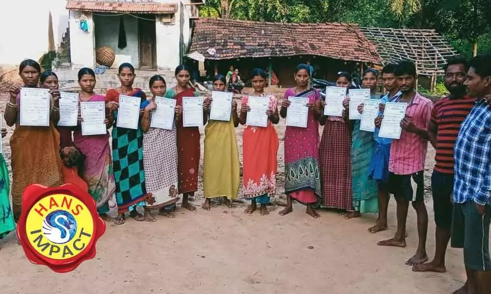 Tribals displaying their caste certificates in Ajaypuram village of Ravikamatham mandal in Visakhapatnam  on Monday