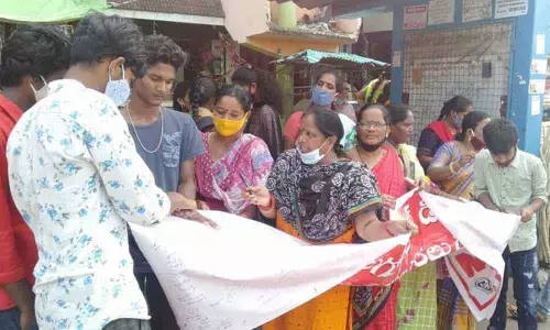 NFIW members collecting signatures against price hike of essential commodities and fuel in Visakhapatnam on Monday
