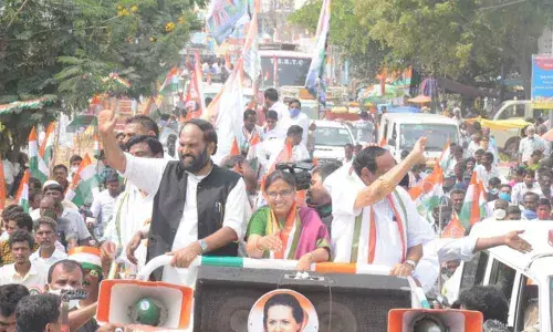 Nalgonda MP N Uttam Kumar Reddy waving to the people during a rally in Kodad on Monday