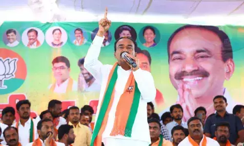 BJP candidate E Rajender addressing a BJYM meeting in Abadi Jammikunta on Monday