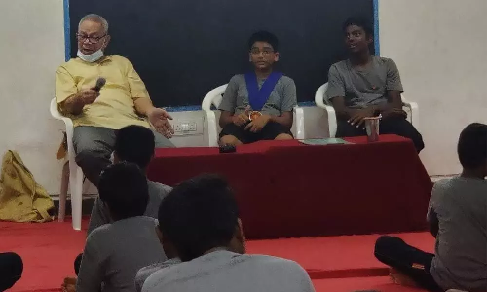 Former AIR announcer PS Bhattu interacting with children at Vidyarthi in Vijayawada on Tuesday