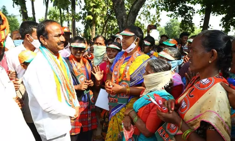 BJP candidate Eatala Rajender speaking to people in Kamalapur mandal of Hanumakonda on Tuesday