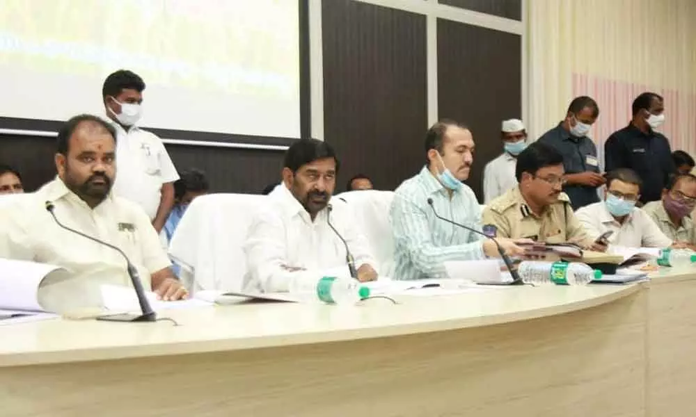 Minister Jagadish Reddy addressing the officials during a review meeting held at District Collectorate in Nalgonda on Tuesday