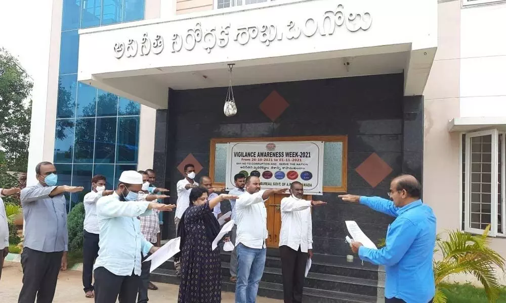 ACB DSP M Suryanarayana Reddy administering anti-corruption pledge to the staff in Ongole on Tuesday
