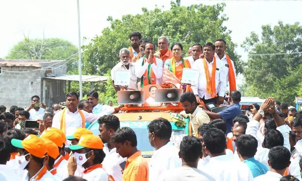 BJP leader Eatala Rajender during an election campaign in Pedda Papayapalli village on Wednesday. Party national vice-president DK Aruna also seen