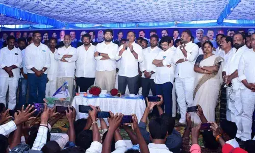 YSRCP MP PV Mithun Reddy addressing a meeting on the occasion of distribution of cheques under the second installment of Aasara scheme, in Kuppam town on Wednesday.