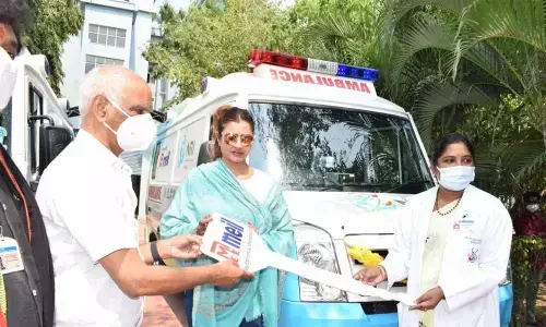 MEIL director P Sudha Reddy handing over the keys of the ambulances to NRI General and Super Specialty Hospital president Narasaraju and principal Lakshmi in Mangalagiri on Wednesday