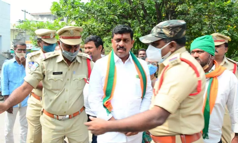 Police taking BJP leaders into custody in Khammam on Thursday