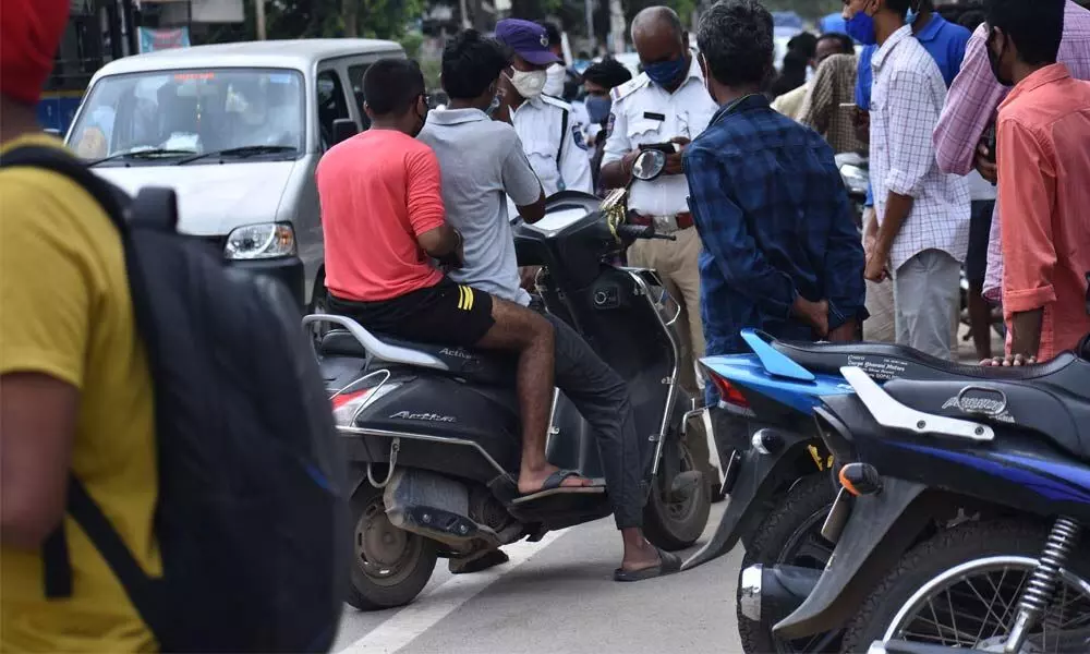 Outrage over challans for pillion riders sans helmets