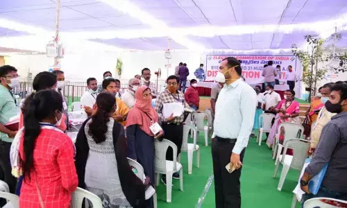 District Collector RV Karnan checking arrangements at the election distribution centre in Huzurabad on Thursday