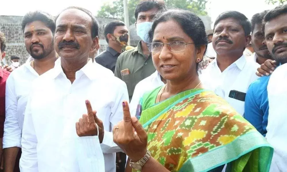 BJP candidate in the election to Huzurabad Assembly seat Eatala Rajender and his wife cast their vote in a polling booth at Kamalapur on Saturday.