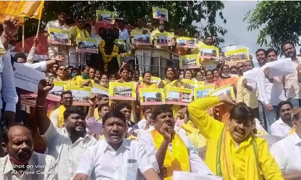 TDP leaders staging a protest at the GVMC Gandhi statue in Visakhapatnam on Saturday