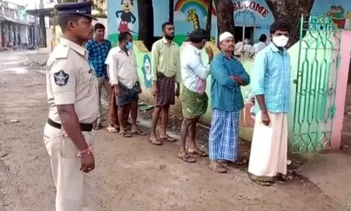 Voters waiting for their turn at Narasapuram polling center.