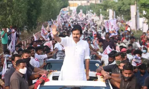 Jana Sena Party chief Pawan Kalyan greeting people at Kurmannapalem in Visakhapatnam on Sunday