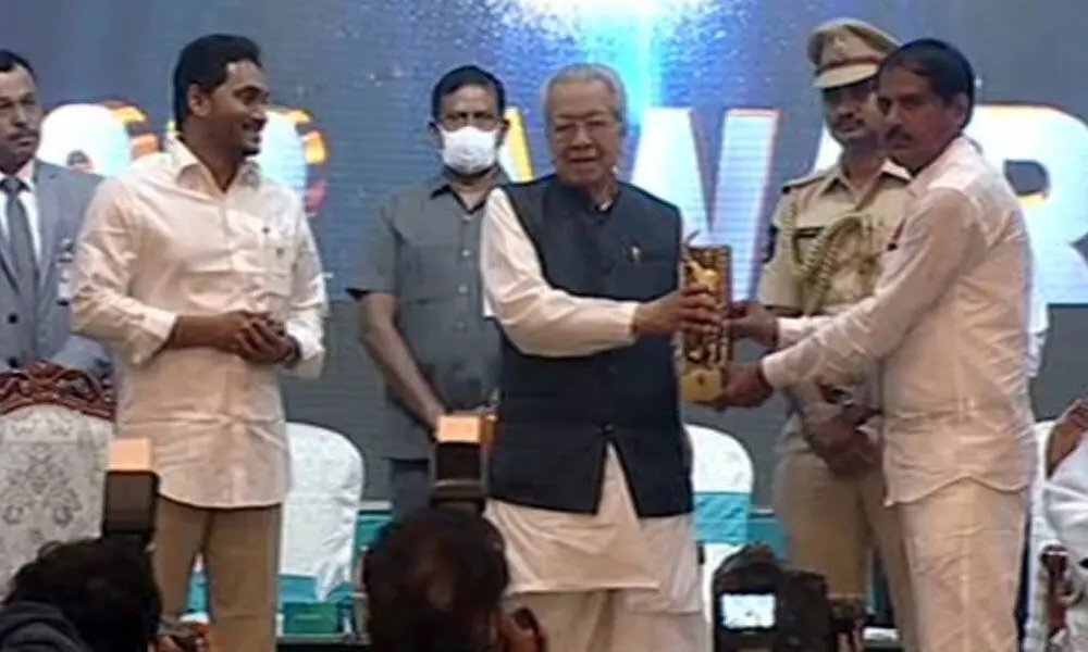 YS Jagan and governor Biswabhushan Harichandan presents YSR Awards in Vijayawada