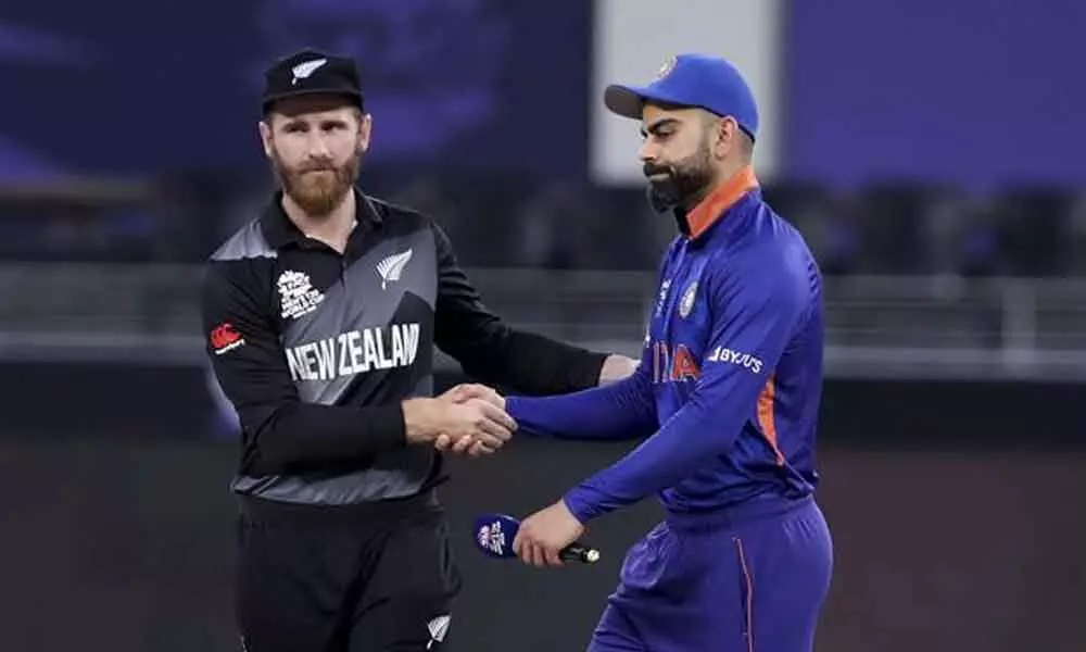 Indias captain Virat Kohli hugs New Zealands captain Kane Williamson after New Zealand won the game by eight wickets during the T20 World Cup match in Dubai, UAE on Sunday