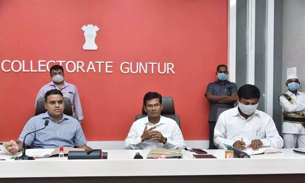 District Collector Vivek Yadav addressing a meeting of revenue officials in Guntur on Tuesday