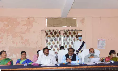 District Collector S Venkat Rao along with Devarkadra MLA Ala Venkateshwar Reddy addressing officials in Devarkadra on Monday