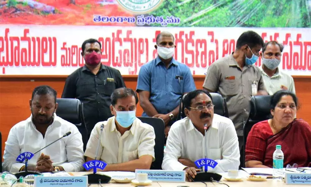 Minister for Panchayat Raj Errabelli Dayakar Rao (second from right) speaking at an all-party meeting on Podu and the protection of forest land in Hanumakonda on Wednesday