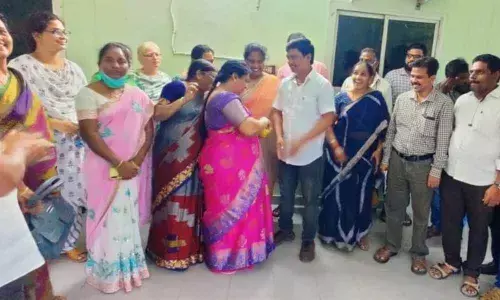 Transport department employees greeting M Rajababu at the RTA office in Vijayawada on Friday