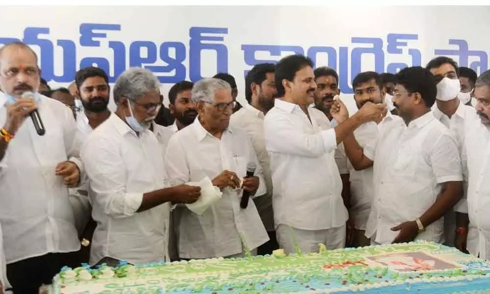 YSRCP leaders cut a cake to mark the four years of Praja Sankalpa Yatra by Y S Jagan Mohan Reddy, at the party central office in Tadepalli on Saturday