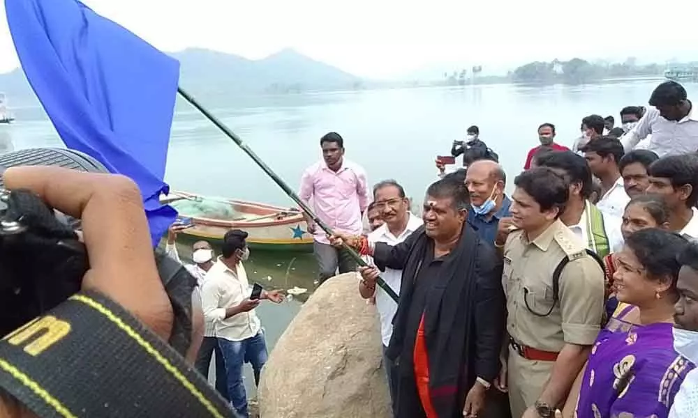 Tourism Minister M Srinivasa Rao flagging off the boat service to Papikondalu at Gandi Pochamma boating point in Devipatnam