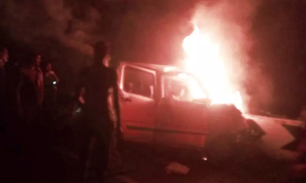 Narrow escape for four as car catches fire on Rajiv Rahadari in Karimnagar
