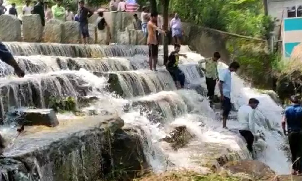 Denizens playing in the overflowing waters of Pungamma Cheruvu in Punganur